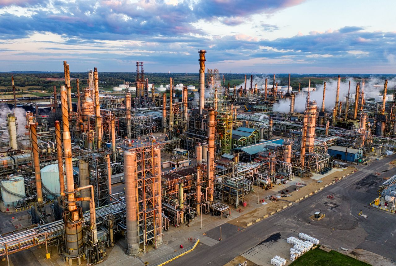 gallery-4 An expansive aerial shot of Pine Bend Oil Refinery in Rosemount, MN, showcasing industrial structures and pollution.
