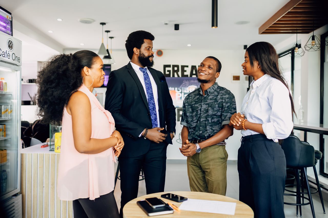 services-01 Group of professionals having a casual meeting in an office setting in Lagos.